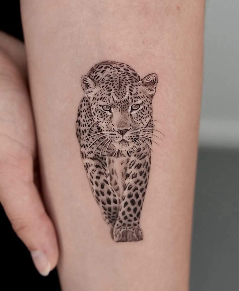 Realistic leopard tattoo showcasing fierce elegance
