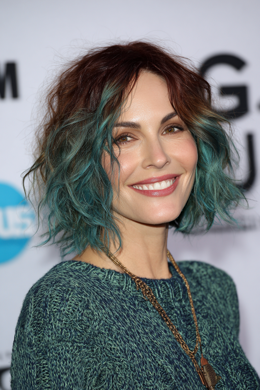 19. Shoulder-Length Shag with Teal Highlights (Edgy Hairstyles For Women Over 40) - Edgy Hairstyles For Women Over 40