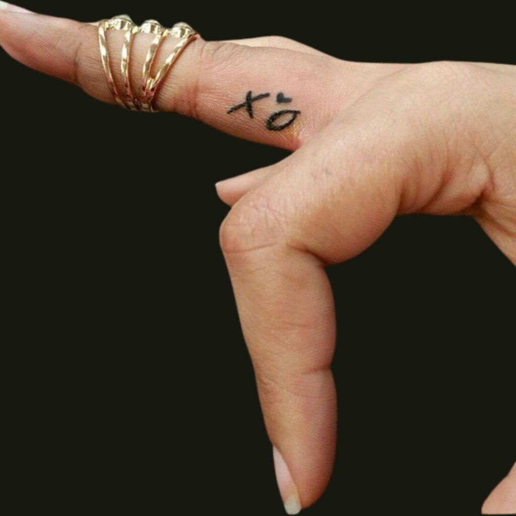 Small XO Finger Tattoo