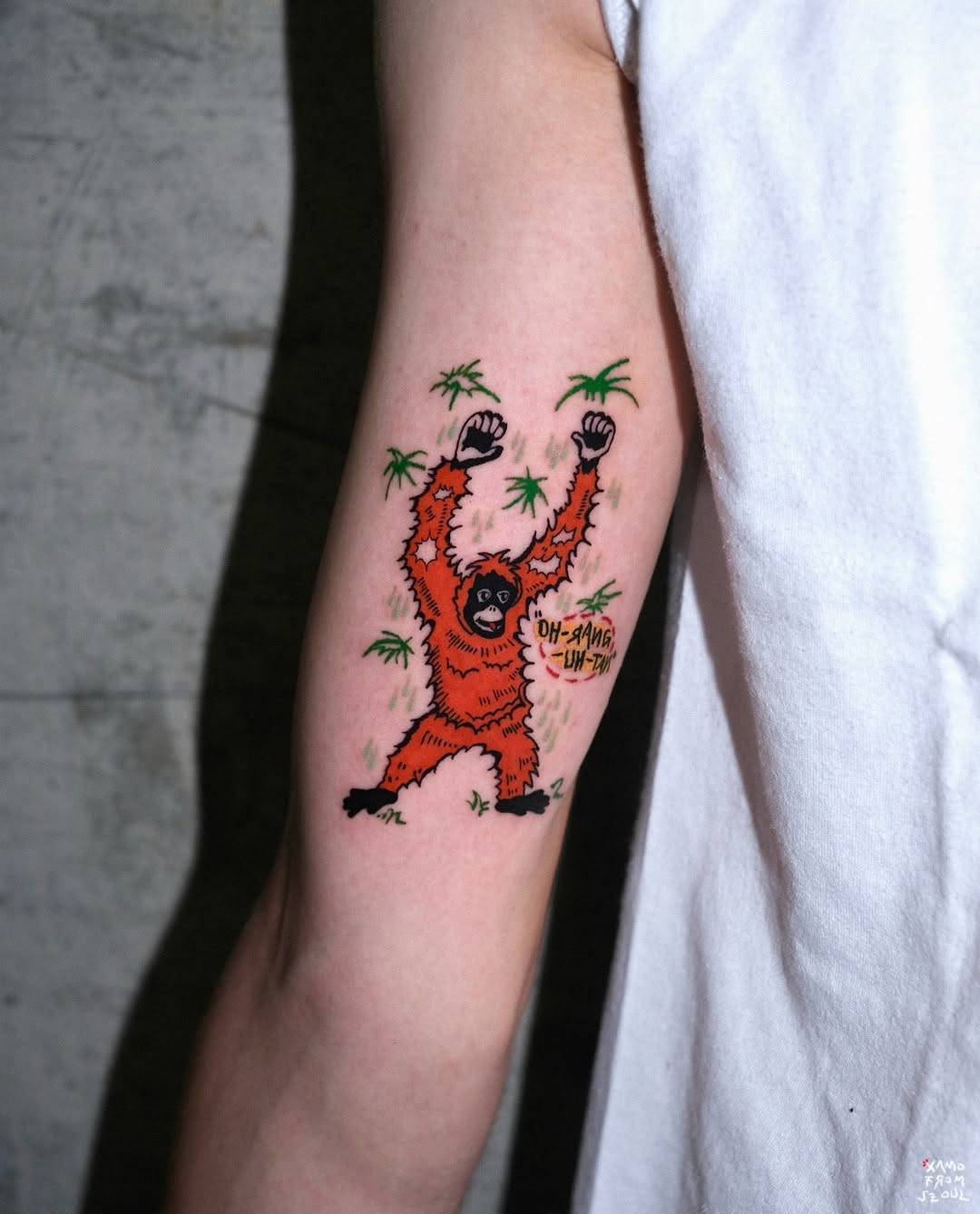 Vibrant monkey tattoo bursting with energy