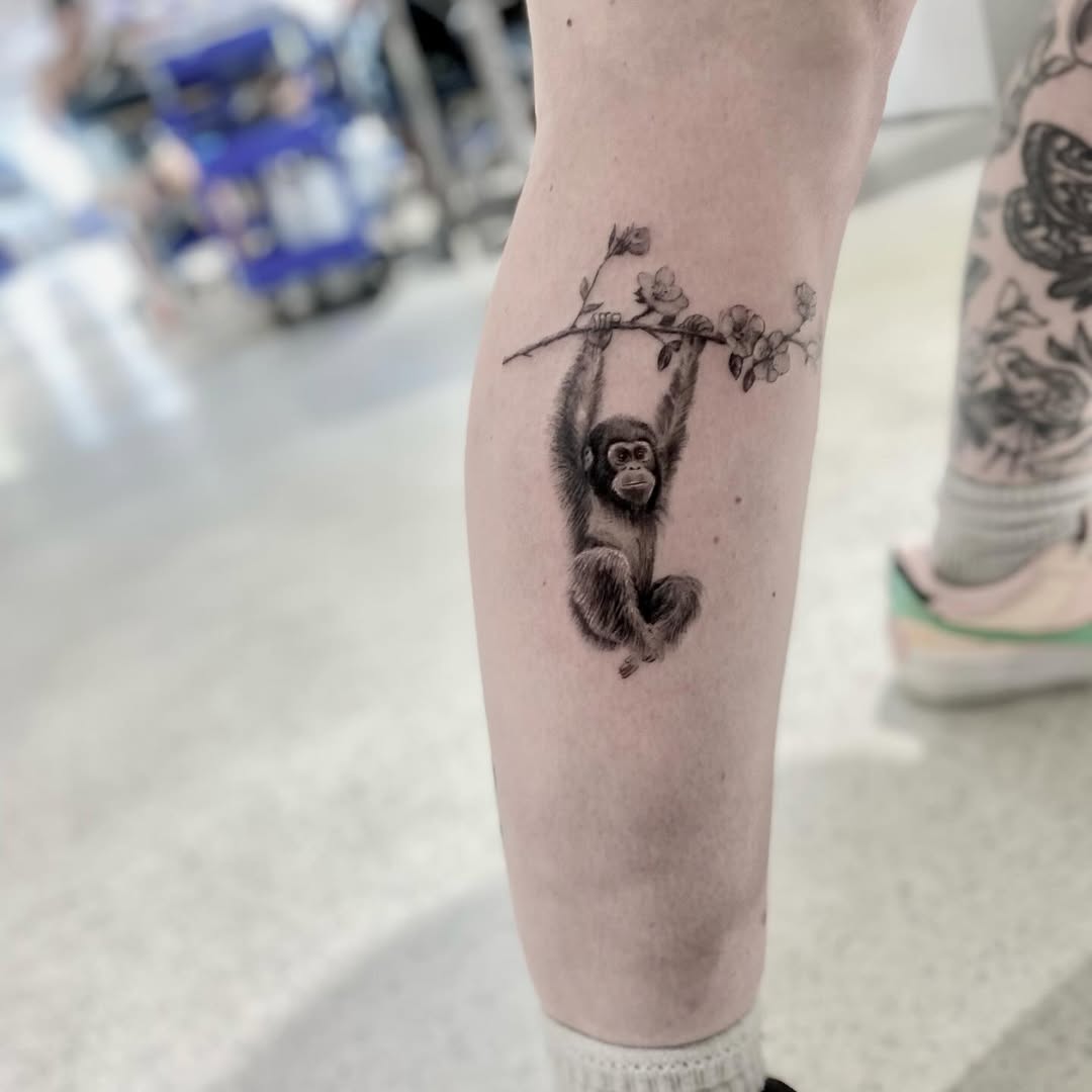 Charming Monkey Tattoo with Branch Detail