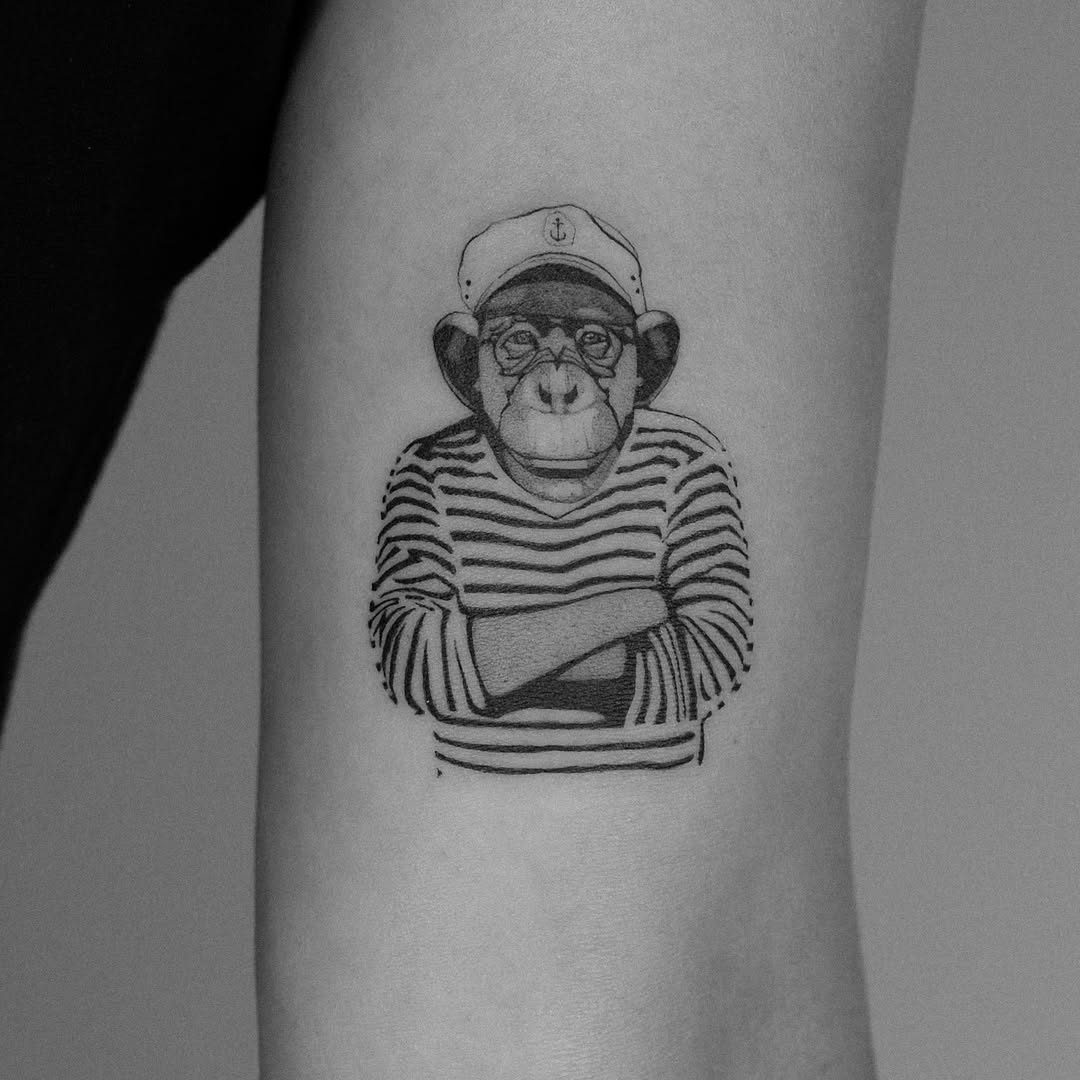Charming Monkey Tattoo with Stripes and Glasses