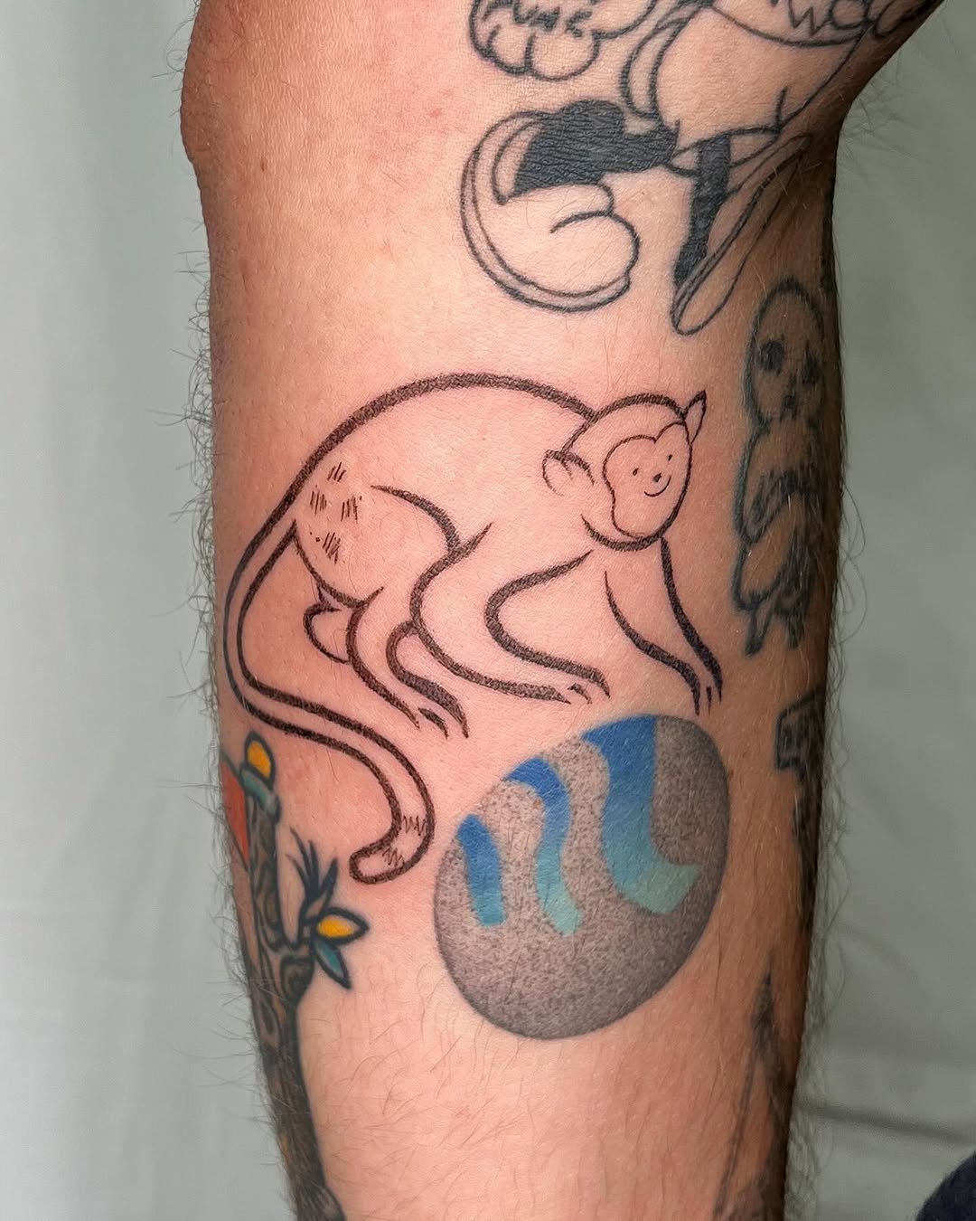 Artistic monkey tattoo bringing playful vibes