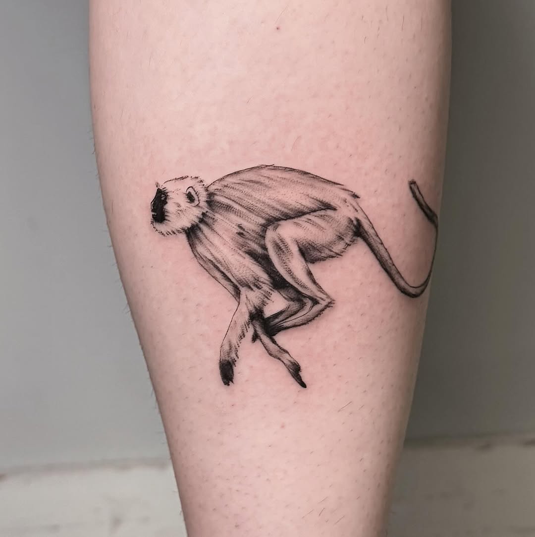 Detailed black and gray monkey tattoo design