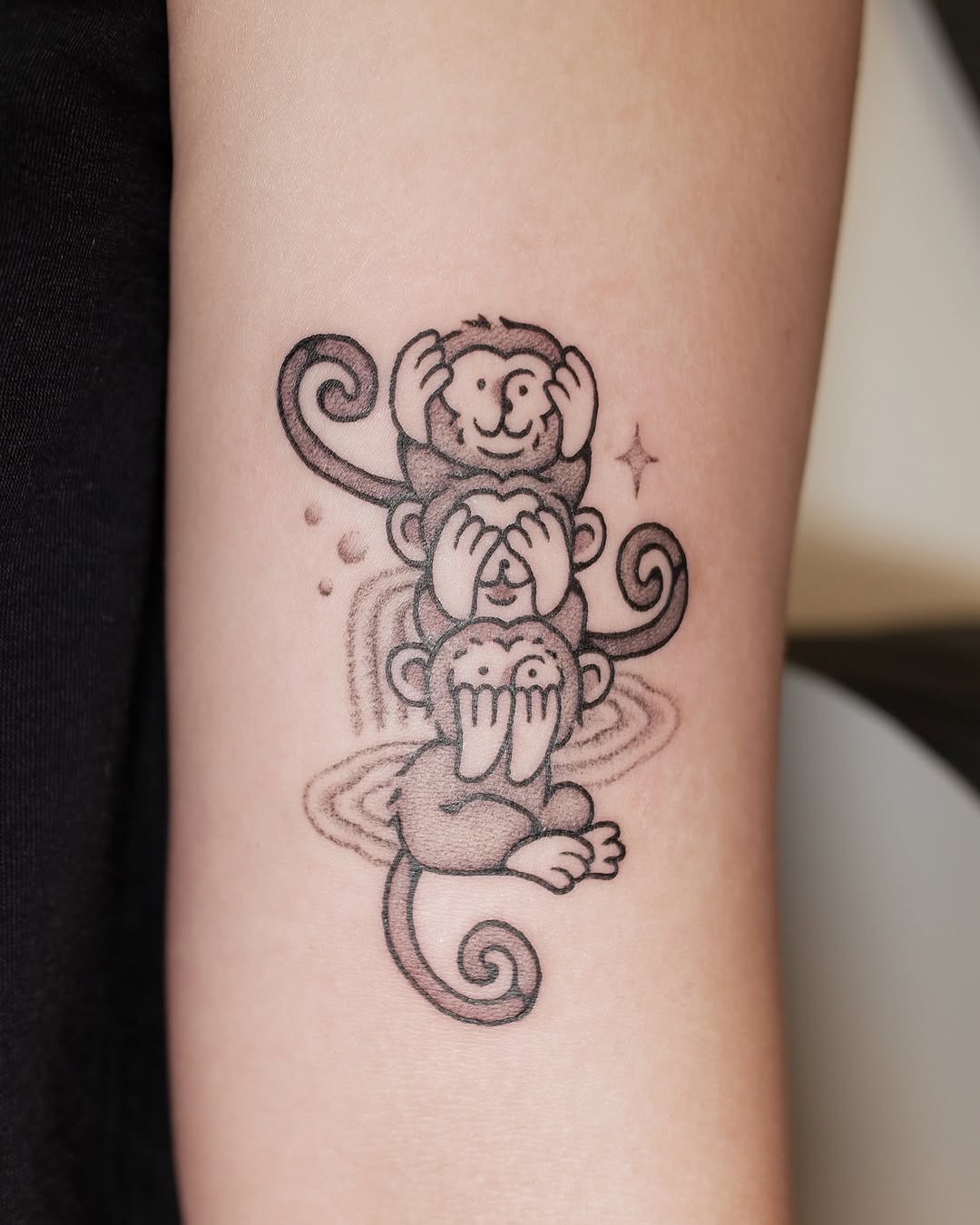 Whimsical Three Monkeys Tattoo in Black Ink