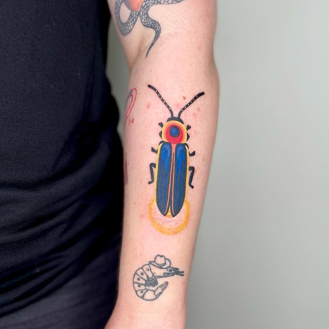 Vivid firefly tattoo with artistic flair