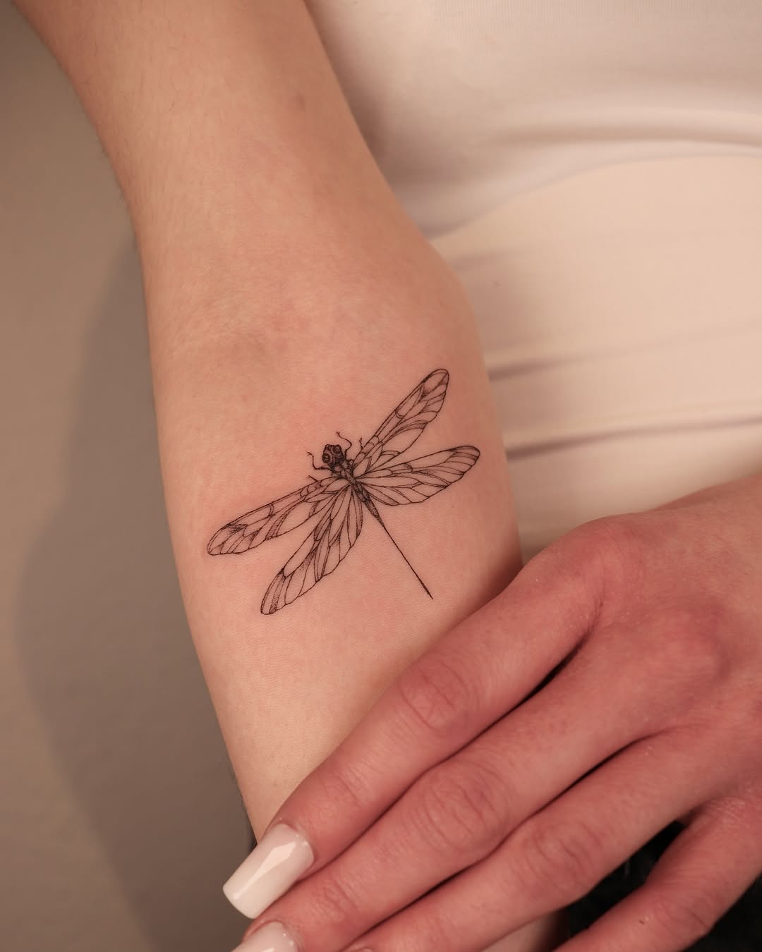 Elegant minimalist firefly tattoo design