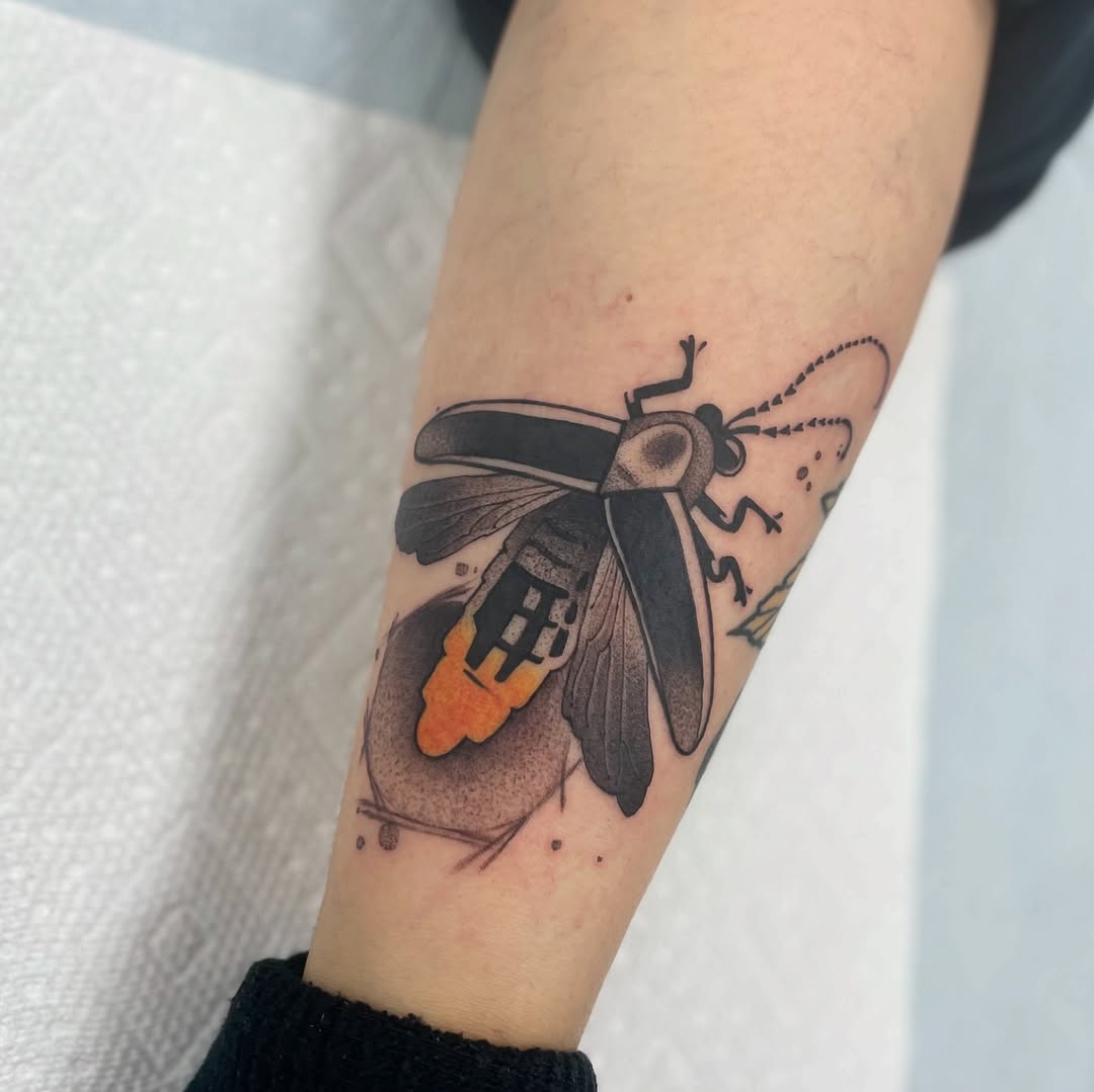 Captivating firefly tattoo with vibrant colors