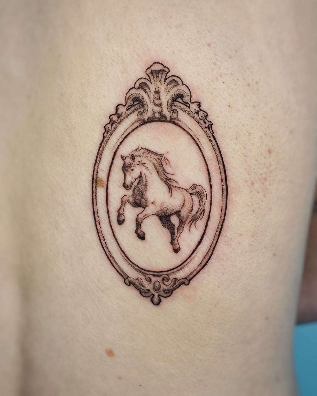 Elegant horse tattoo in ornate vintage frame
