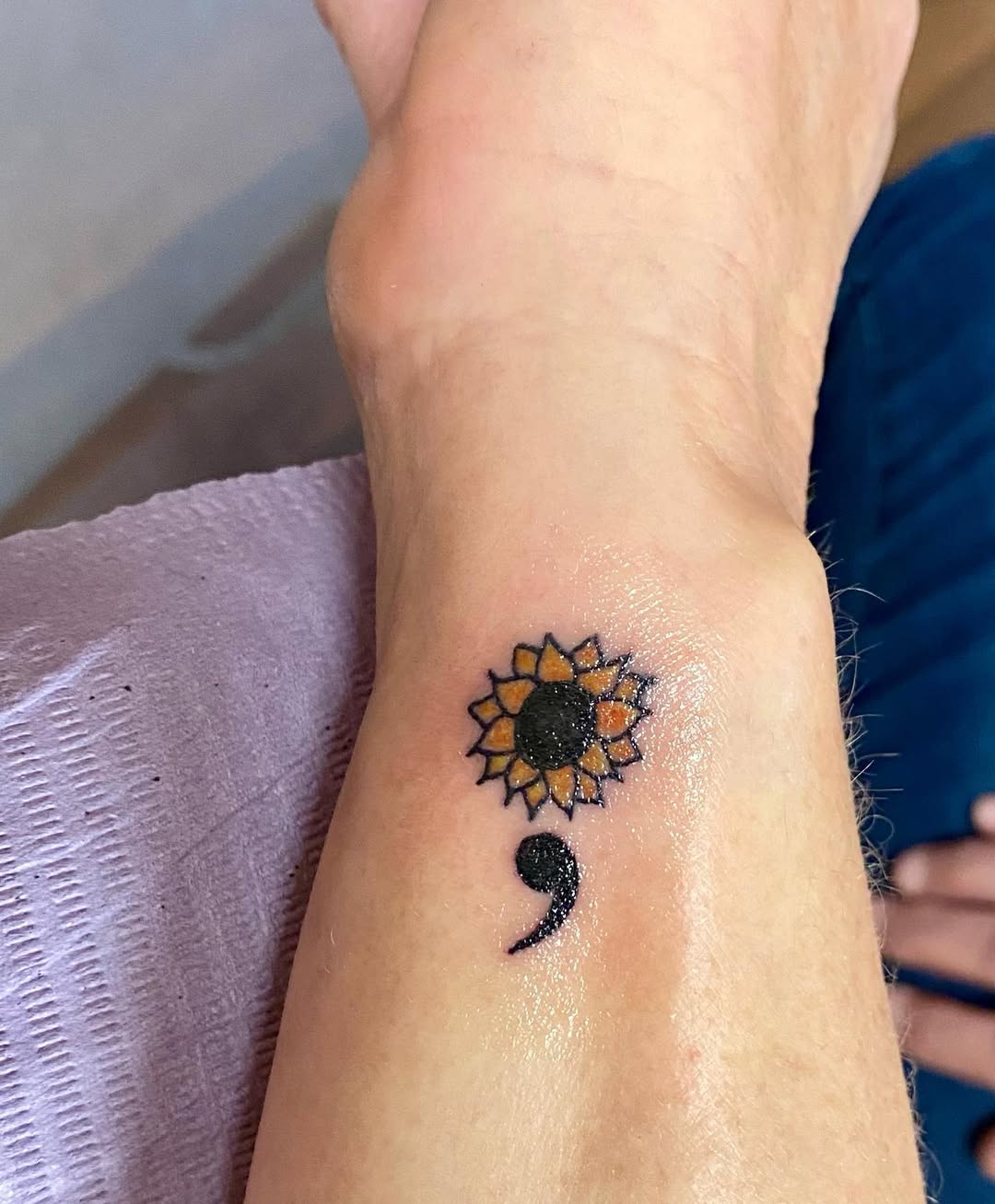 A unique blend of sunflower and semicolon tattoo