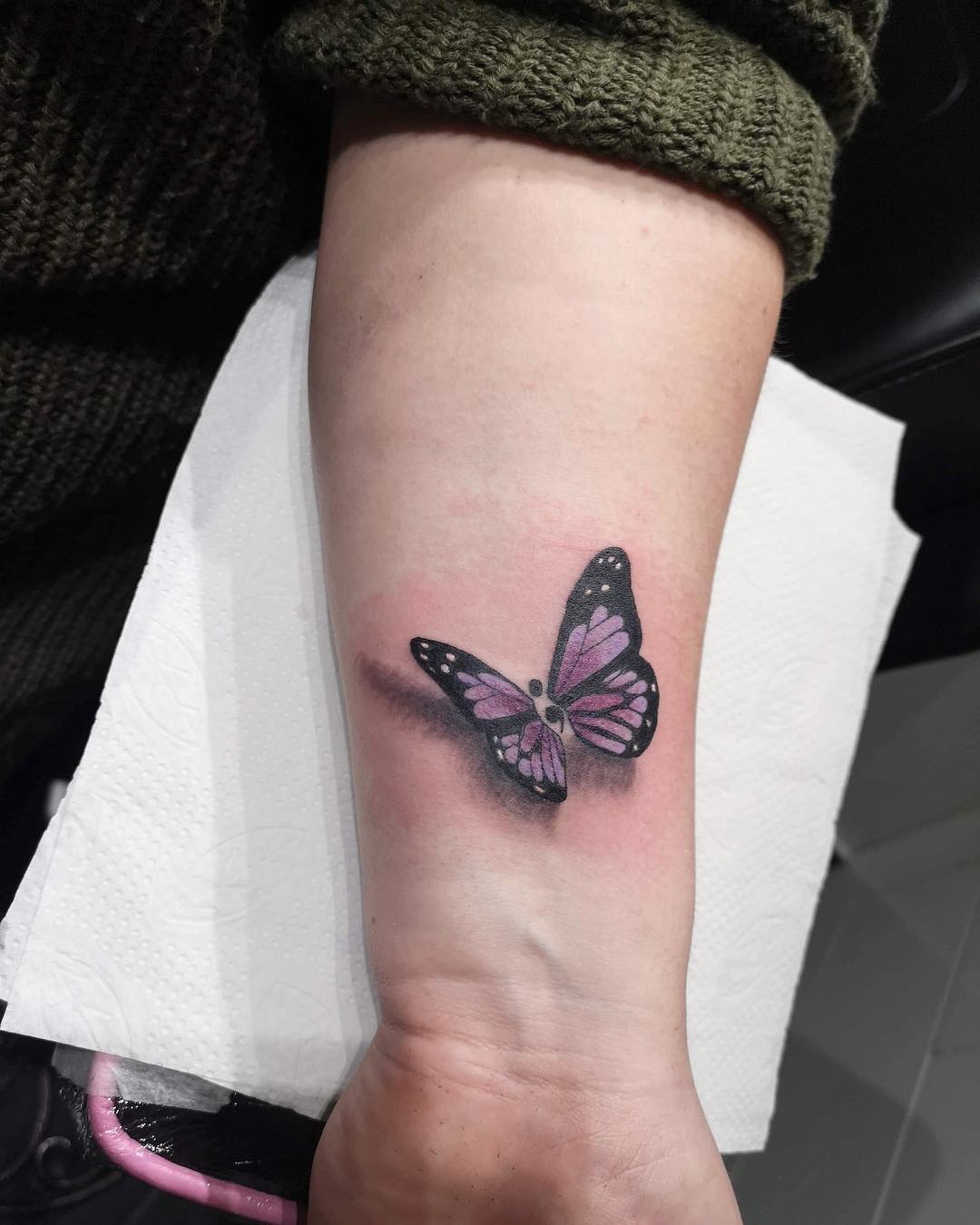 Vibrant Butterfly Tattoo on Inner Forearm