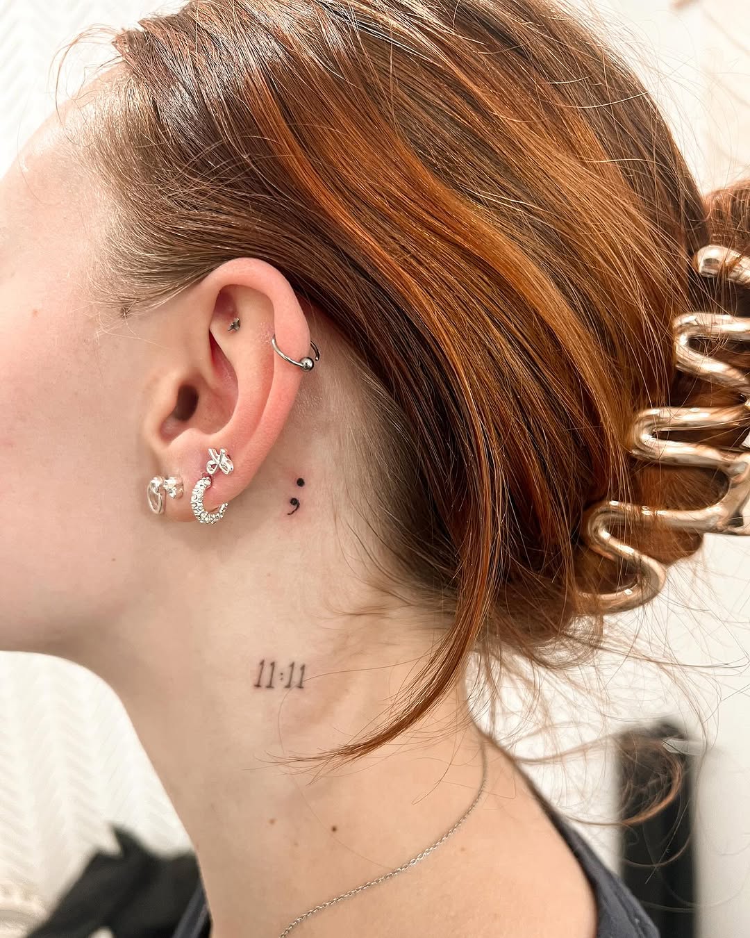Elegant semicolon tattoo behind the ear