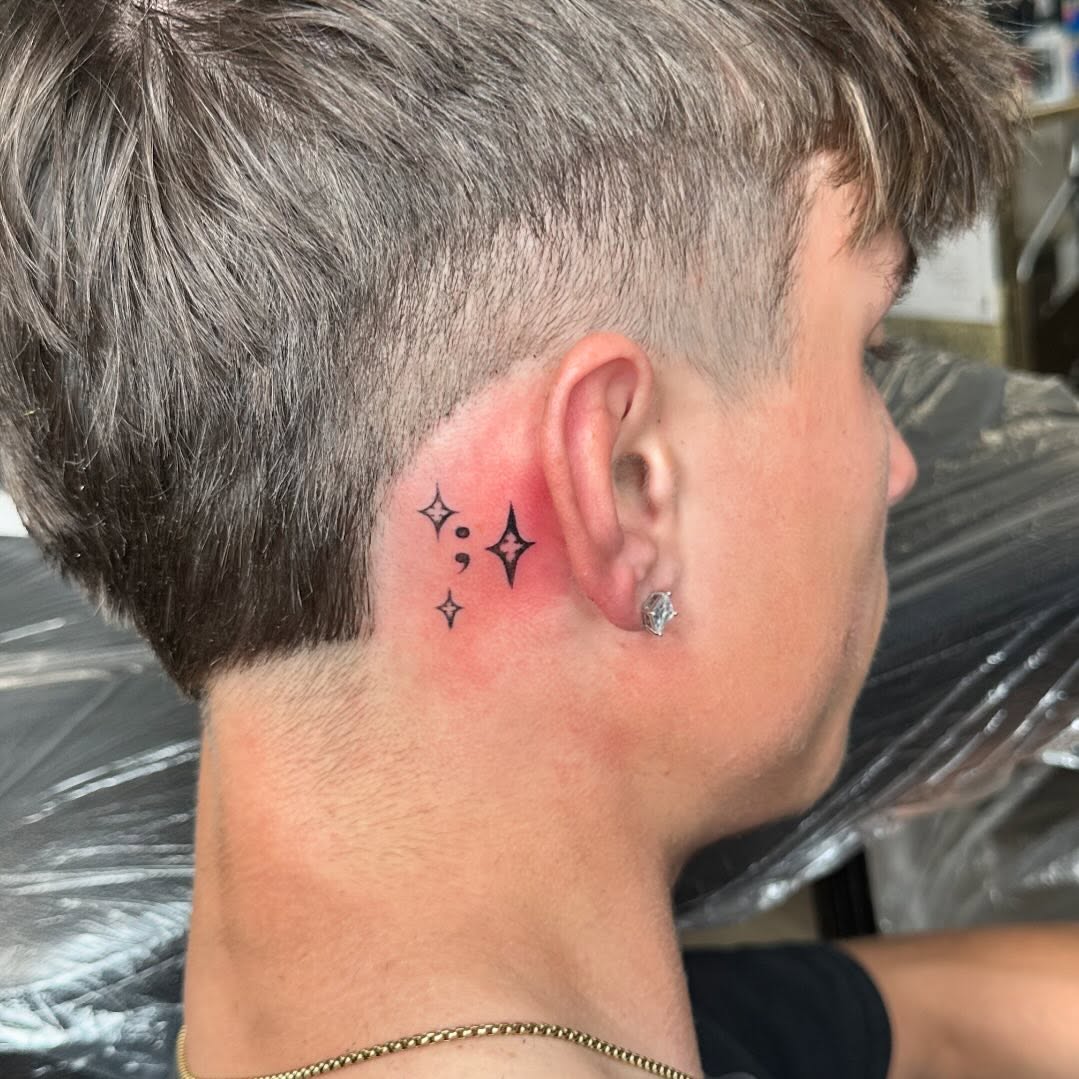 Unique semicolon tattoo with sparkling accents