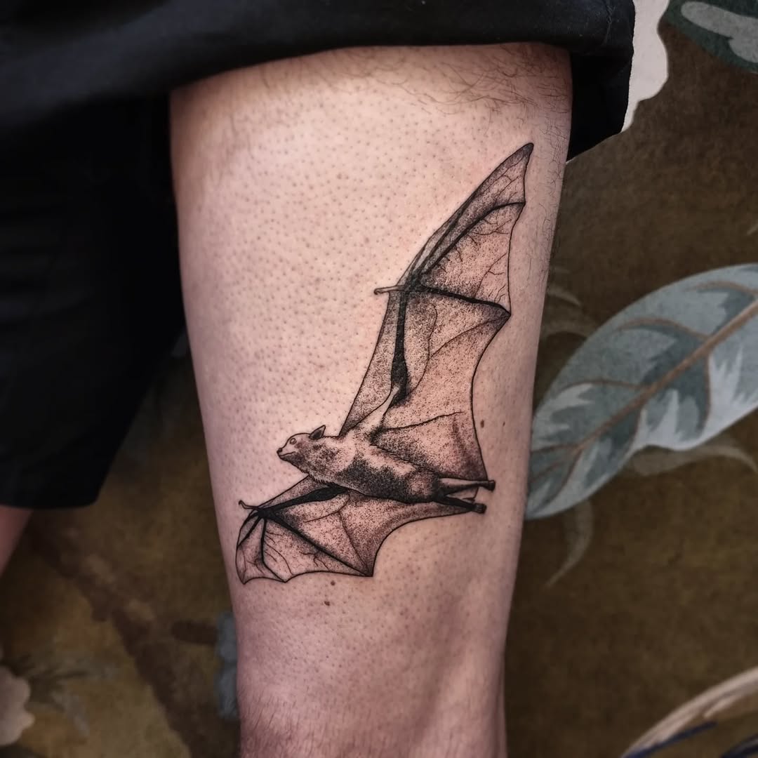 Elegant bat tattoo spreading its wings