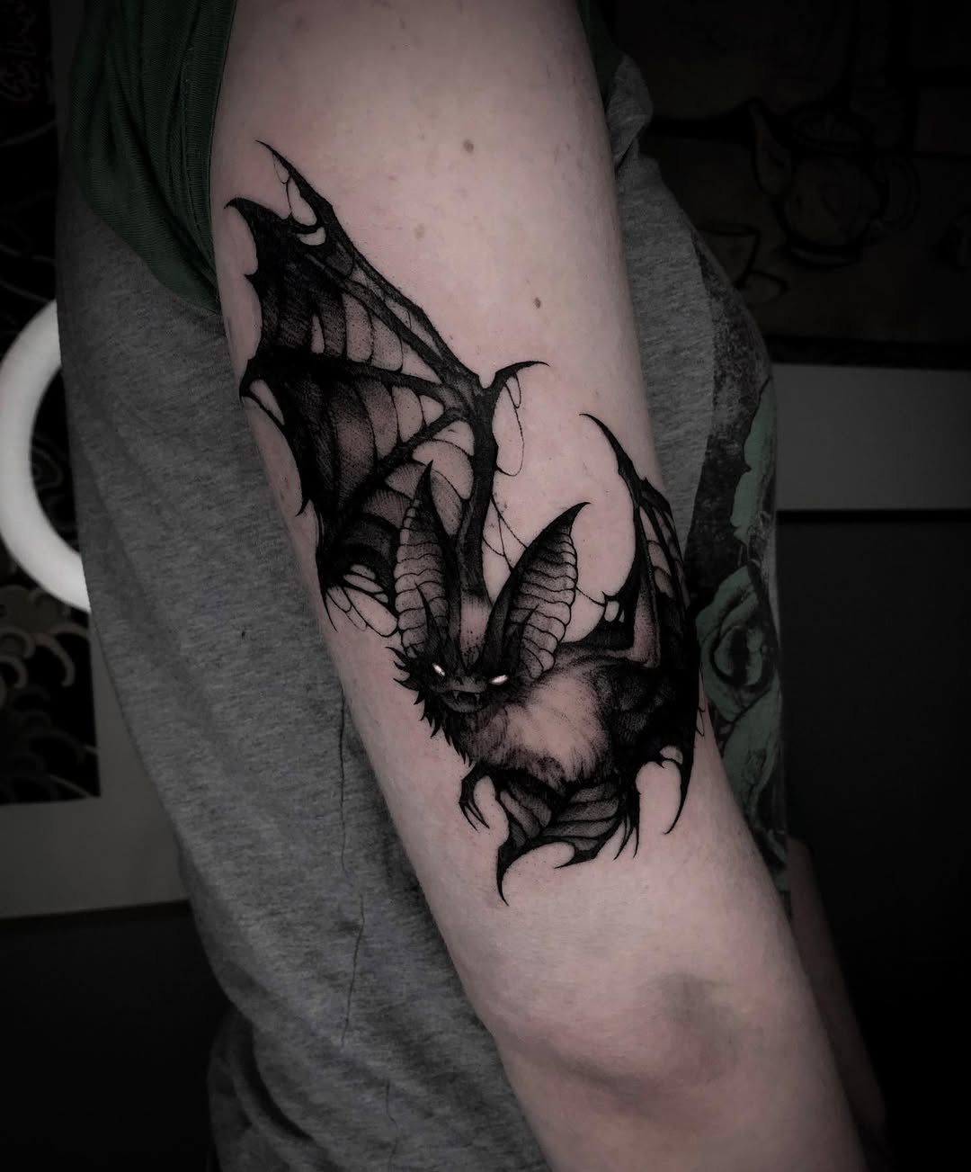 Dramatic bat tattoo showcasing intricate details