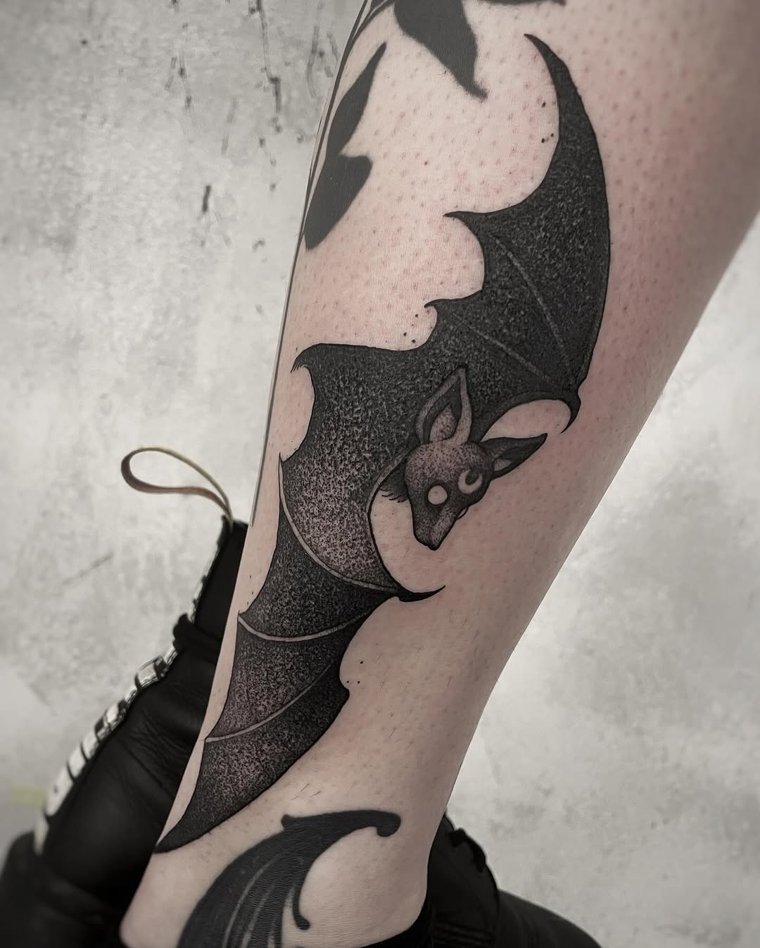 Elegant bat tattoo showcasing intricate design details