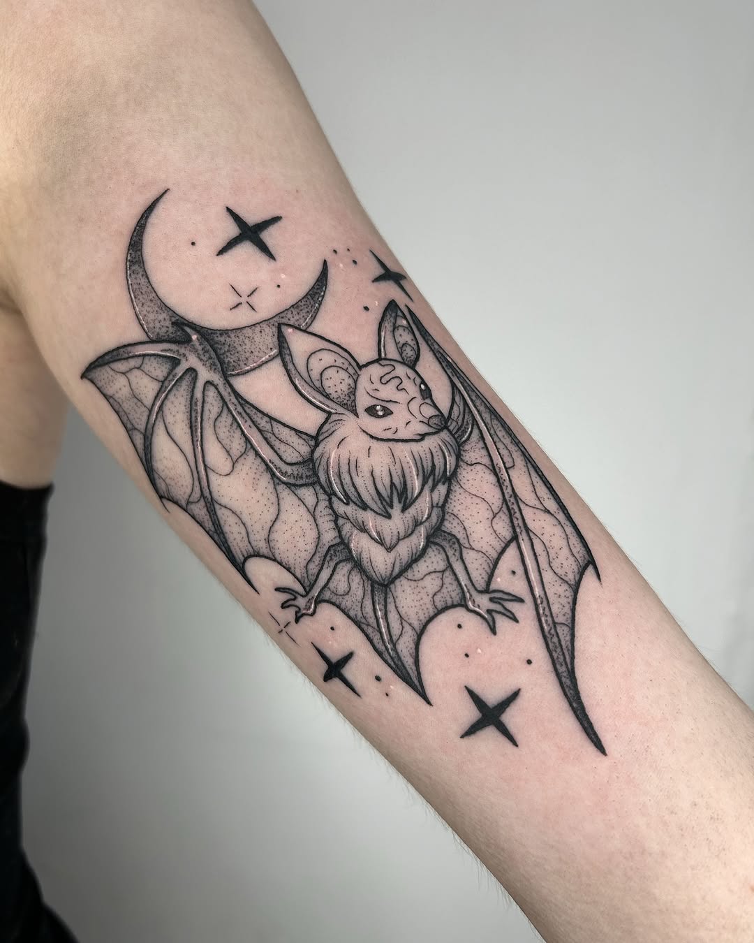 Elegant bat design with celestial elements