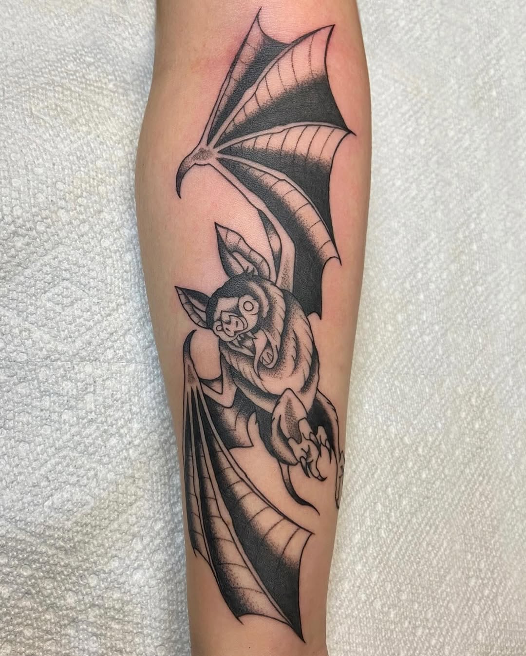 Intricate bat tattoo design in bold black ink