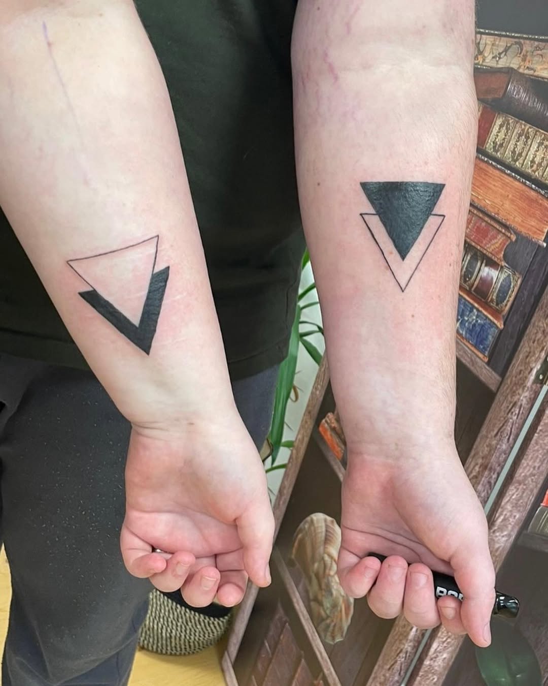 Stylish geometric father-daughter matching tattoos