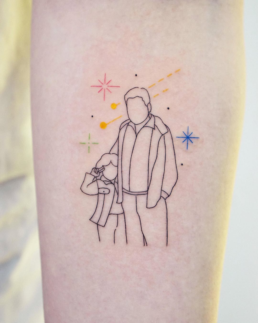 Elegant father-daughter outline tattoo design