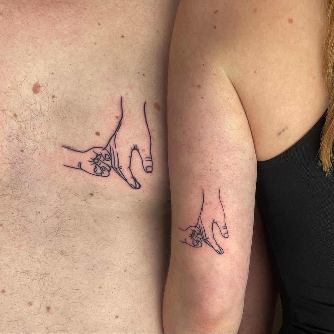 Symbolic father-daughter hand tattoos connection