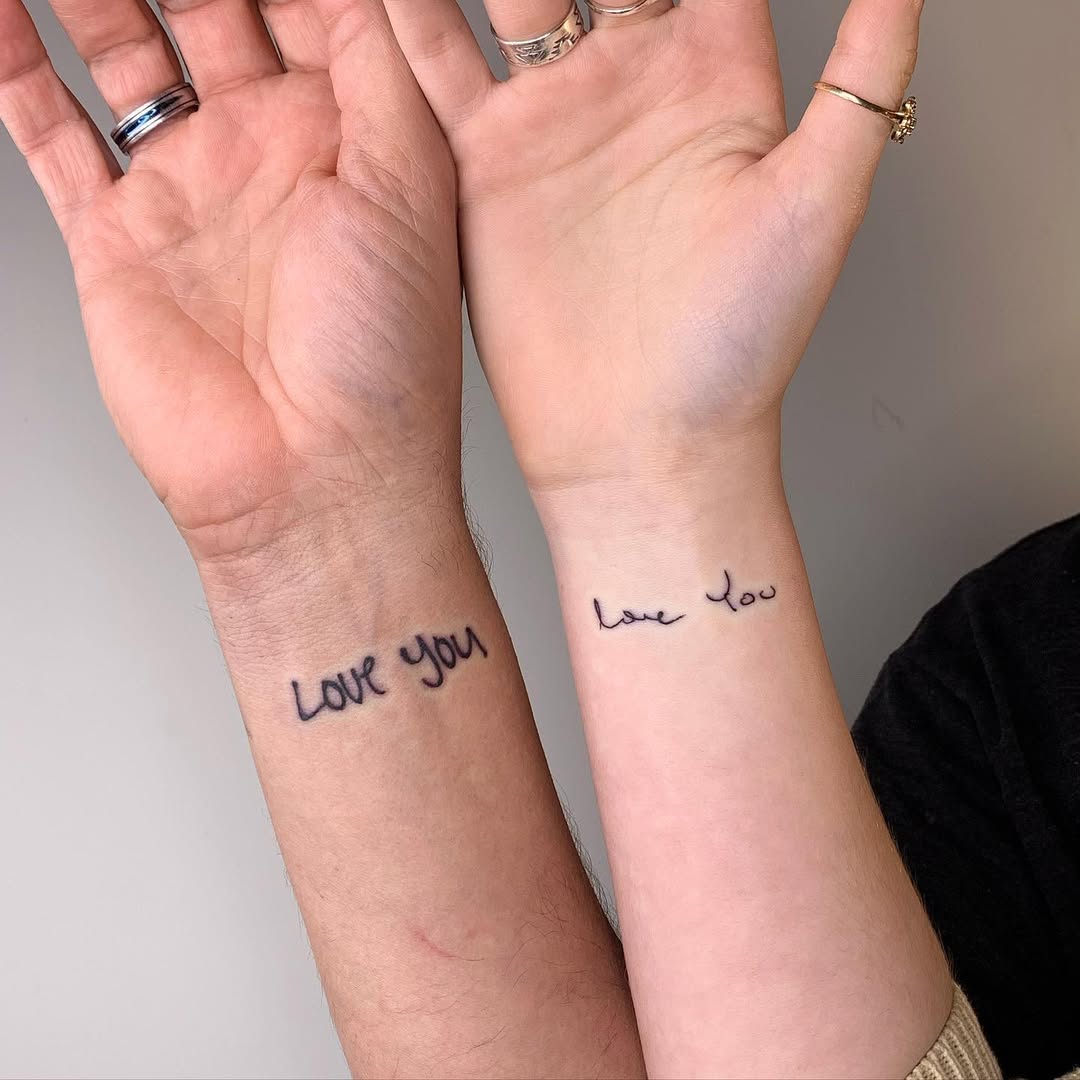 Simple love tattoos between father and daughter