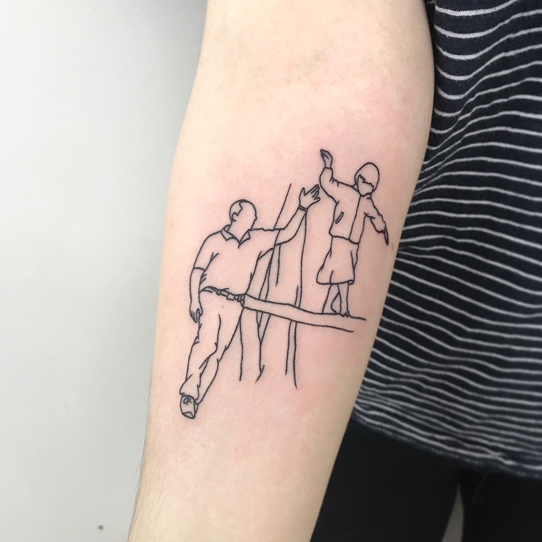 Heartfelt connection through minimalist tattoo art