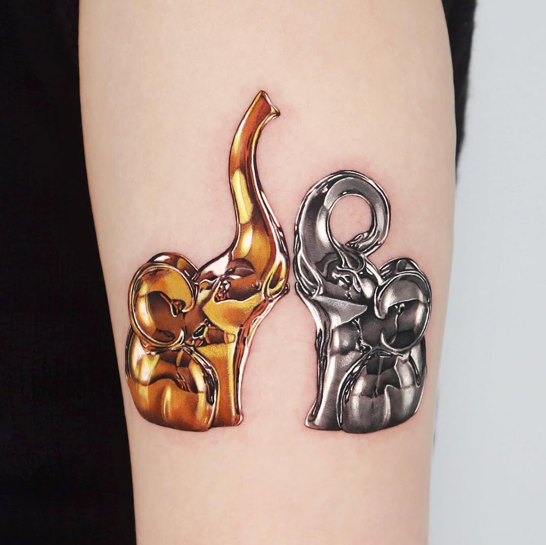 Stylish father-daughter elephant tattoo duo