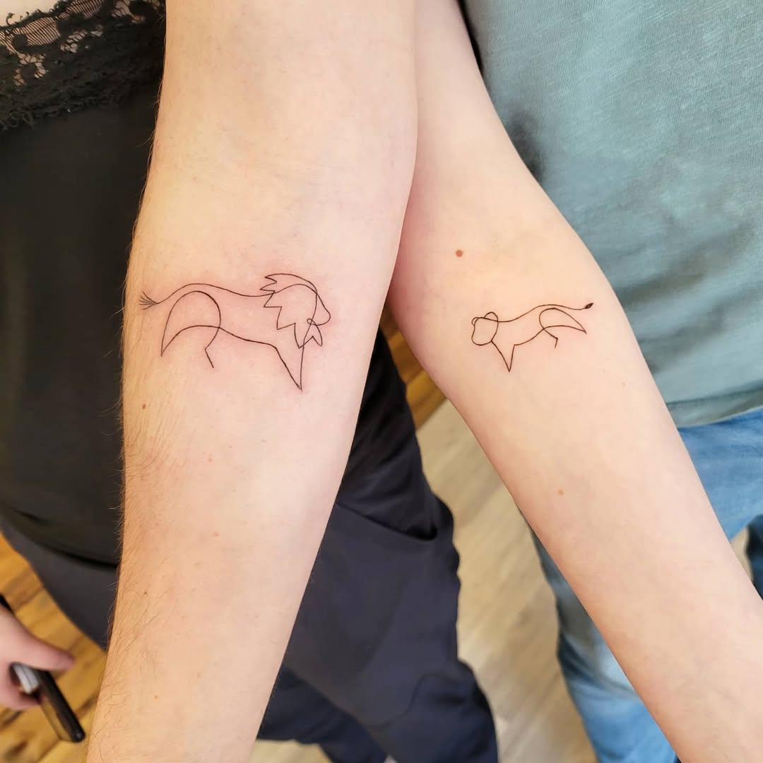 Stylish line art father-daughter tattoos