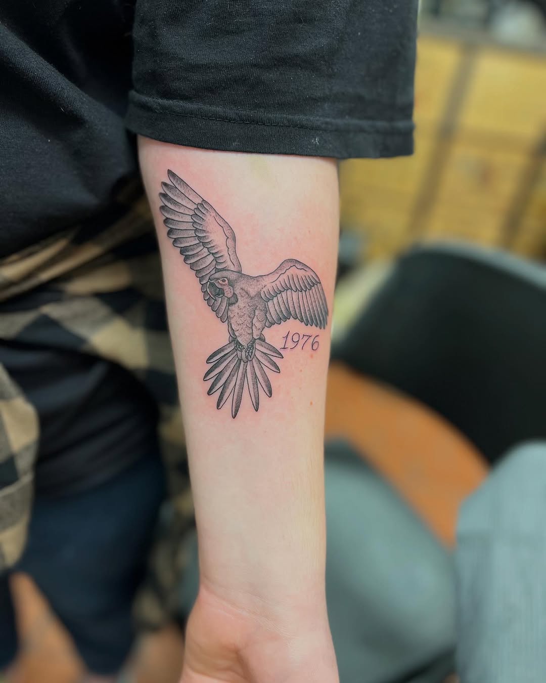 Stylish parrot tattoo with a vintage touch