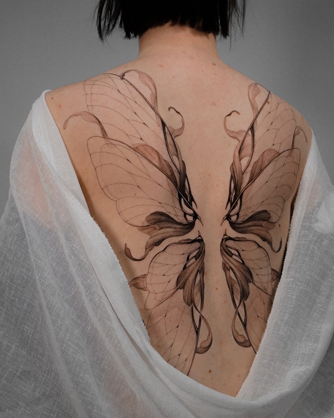 Elegant fairy wing tattoo design on back