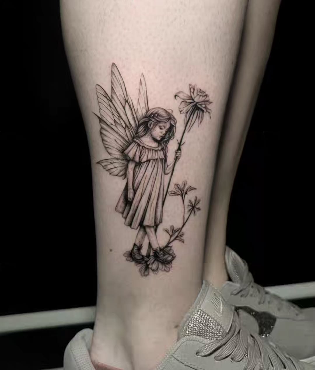 Enchanting fairy tattoo design on the leg