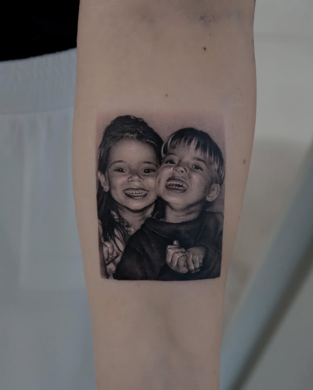 Emotive Portrait of Siblings Captured in Ink