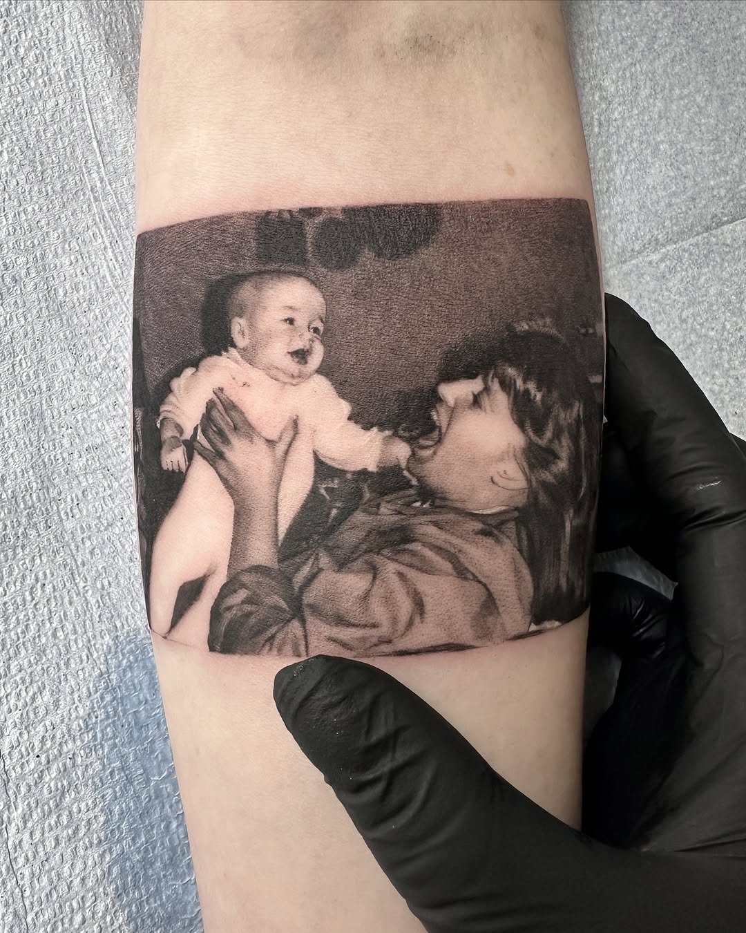 Heartwarming mother and child tattoo design
