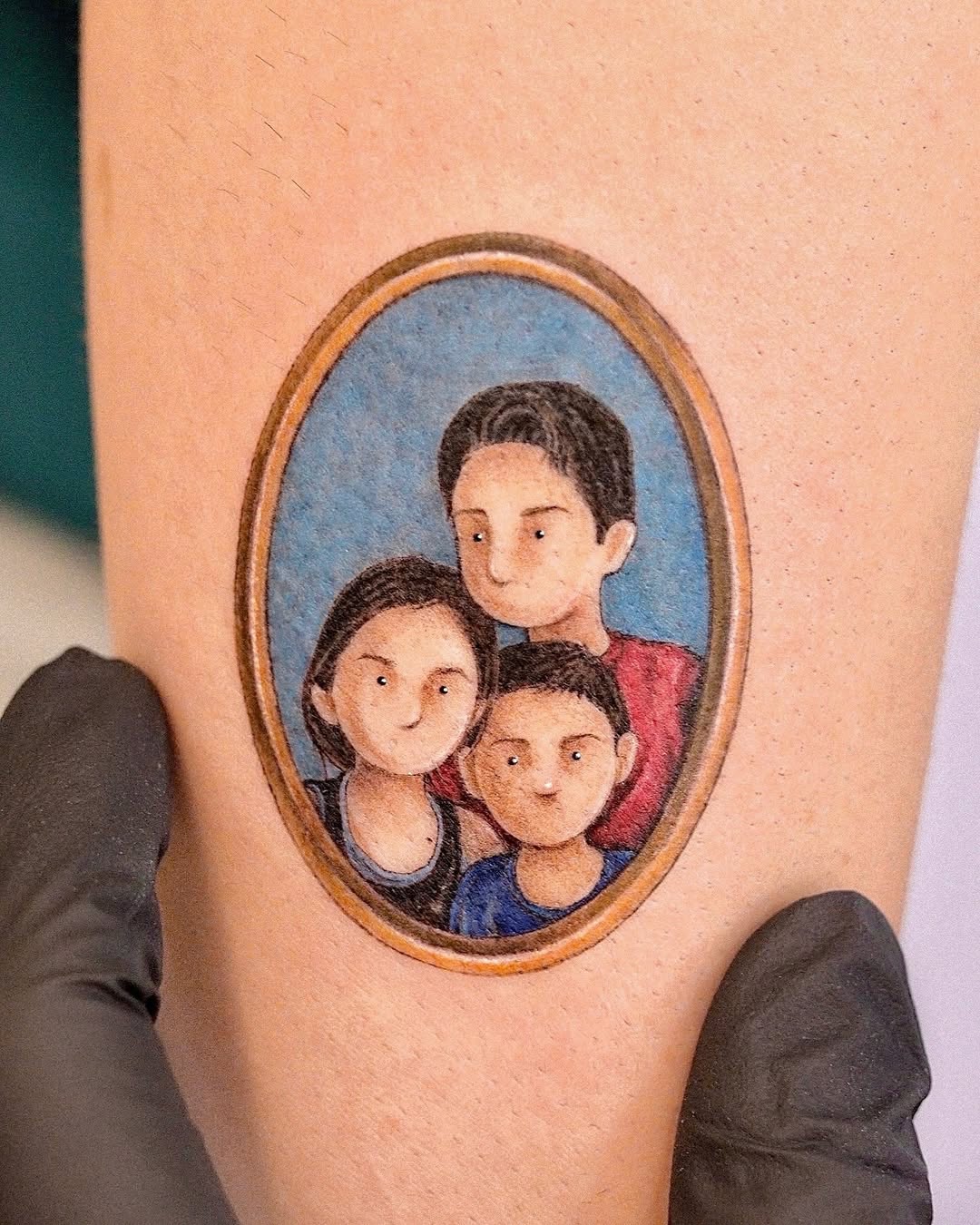 Vibrant Family Portrait Tattoo in a Frame
