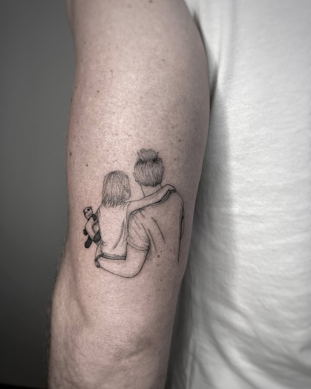Emotional bond depicted in meaningful tattoo