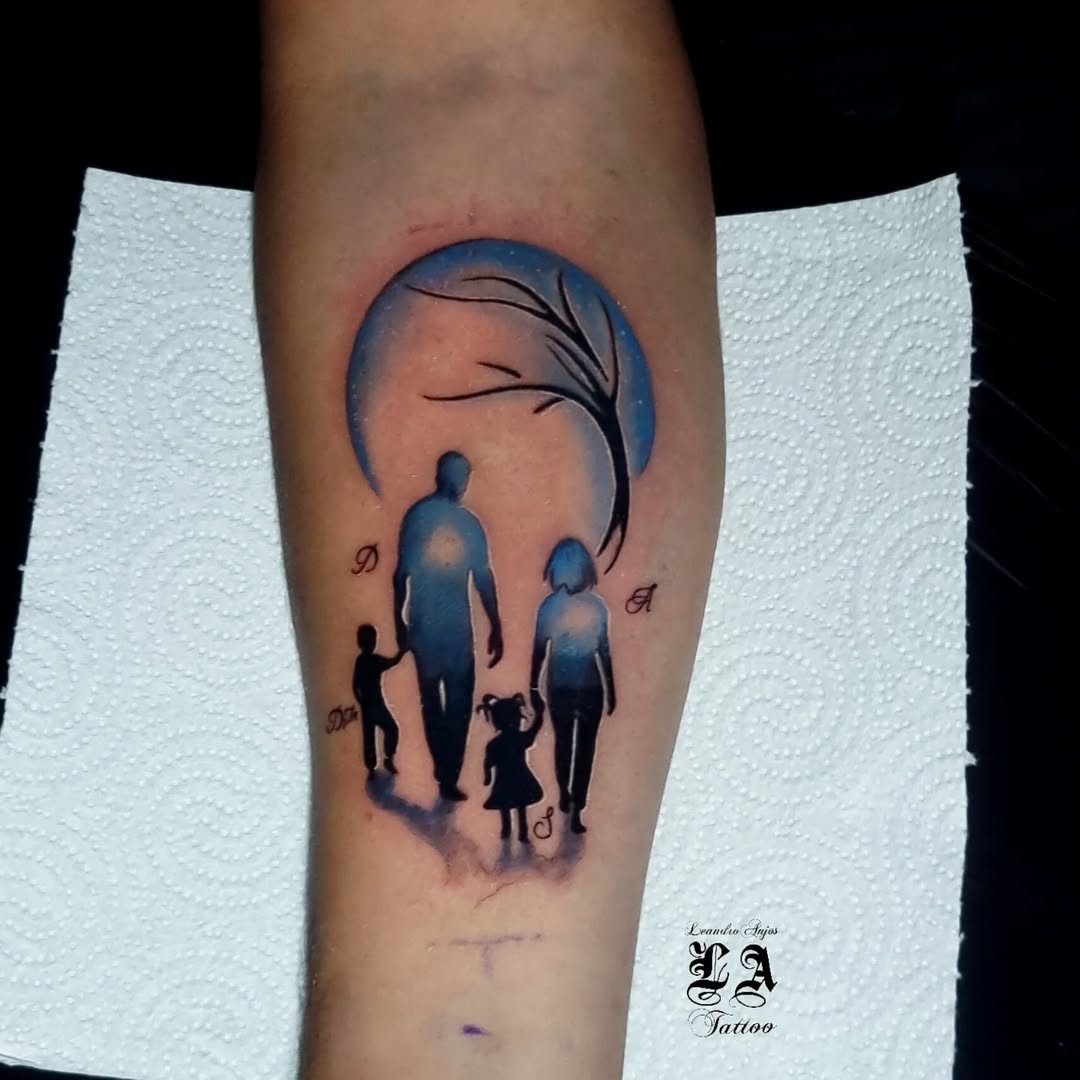 Silhouette of a family under a crescent moon