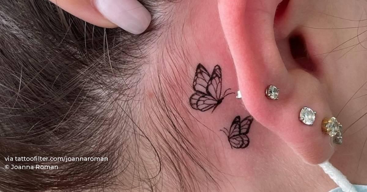 Fine line butterflies tattoo behind the ear.