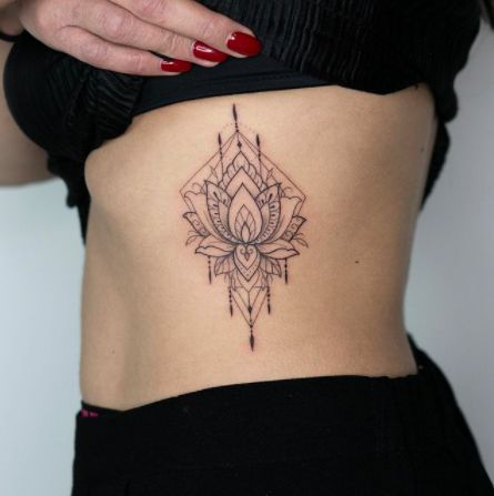 Rib Lotus Flower Tattoo