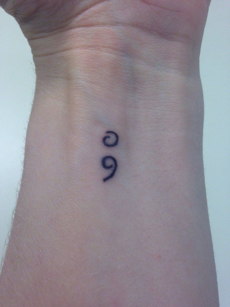 simple semicolon tattoo behind ear