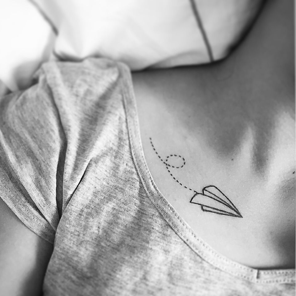 Flying paper plane tattoo on the clavicle bone - Tattoogrid.net