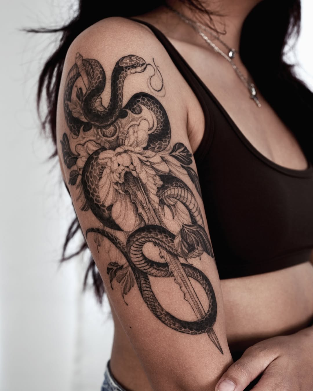 Stunning Snake and Floral Arm Tattoo Design