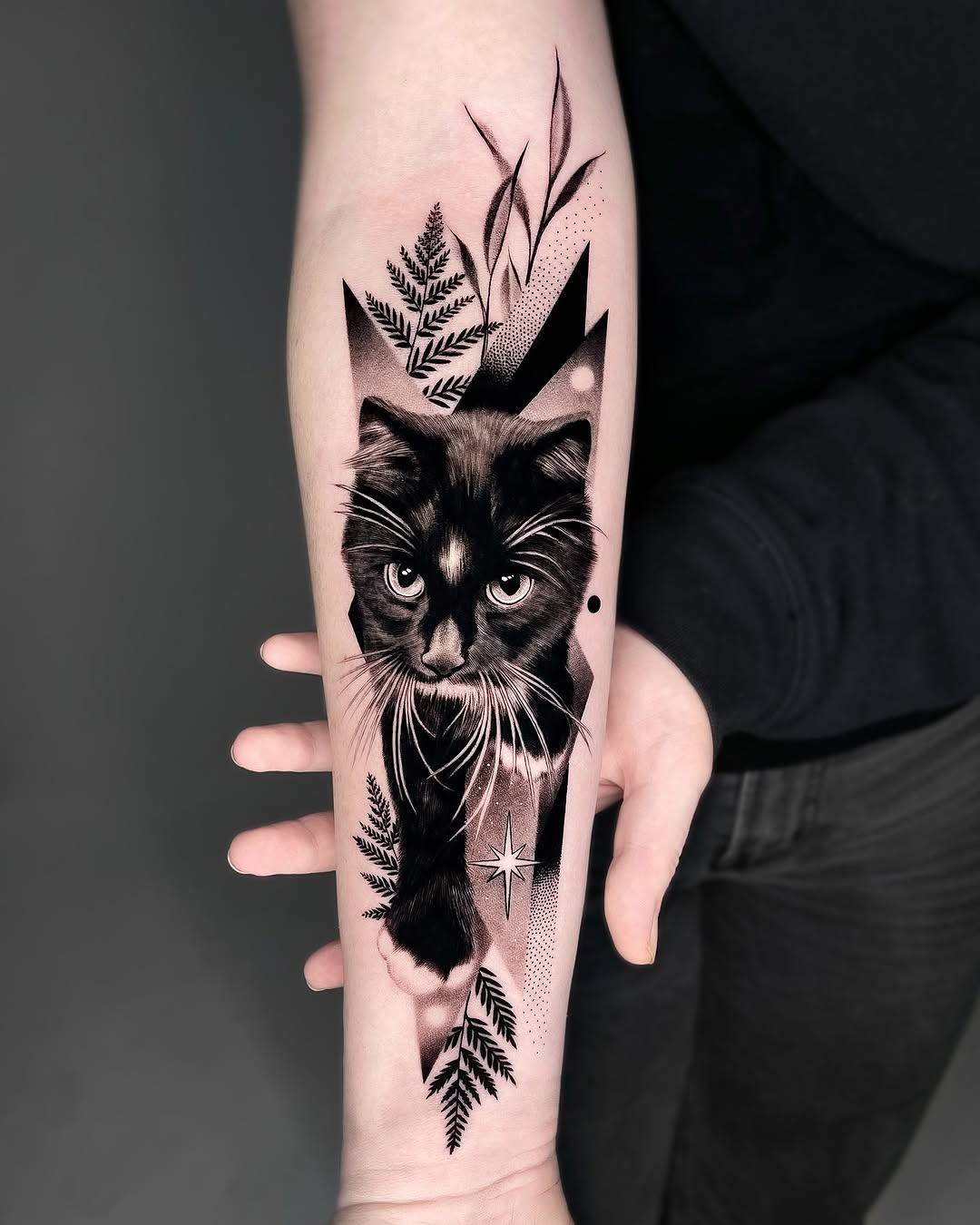 Stunning black and gray cat arm tattoo