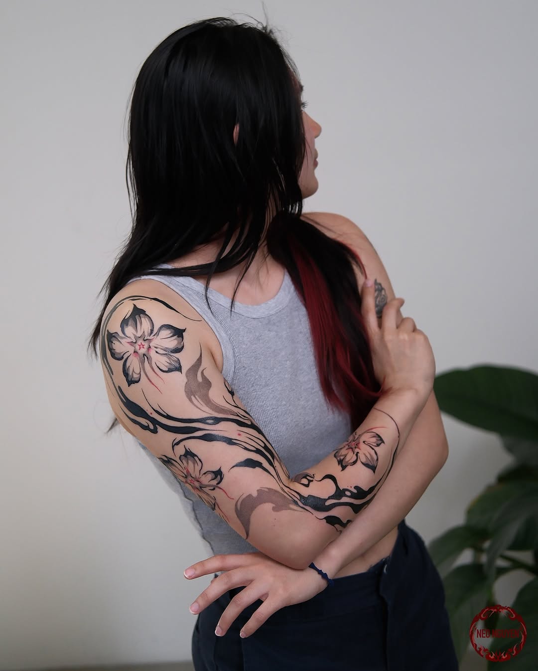 Elegant floral arm tattoos for stylish women