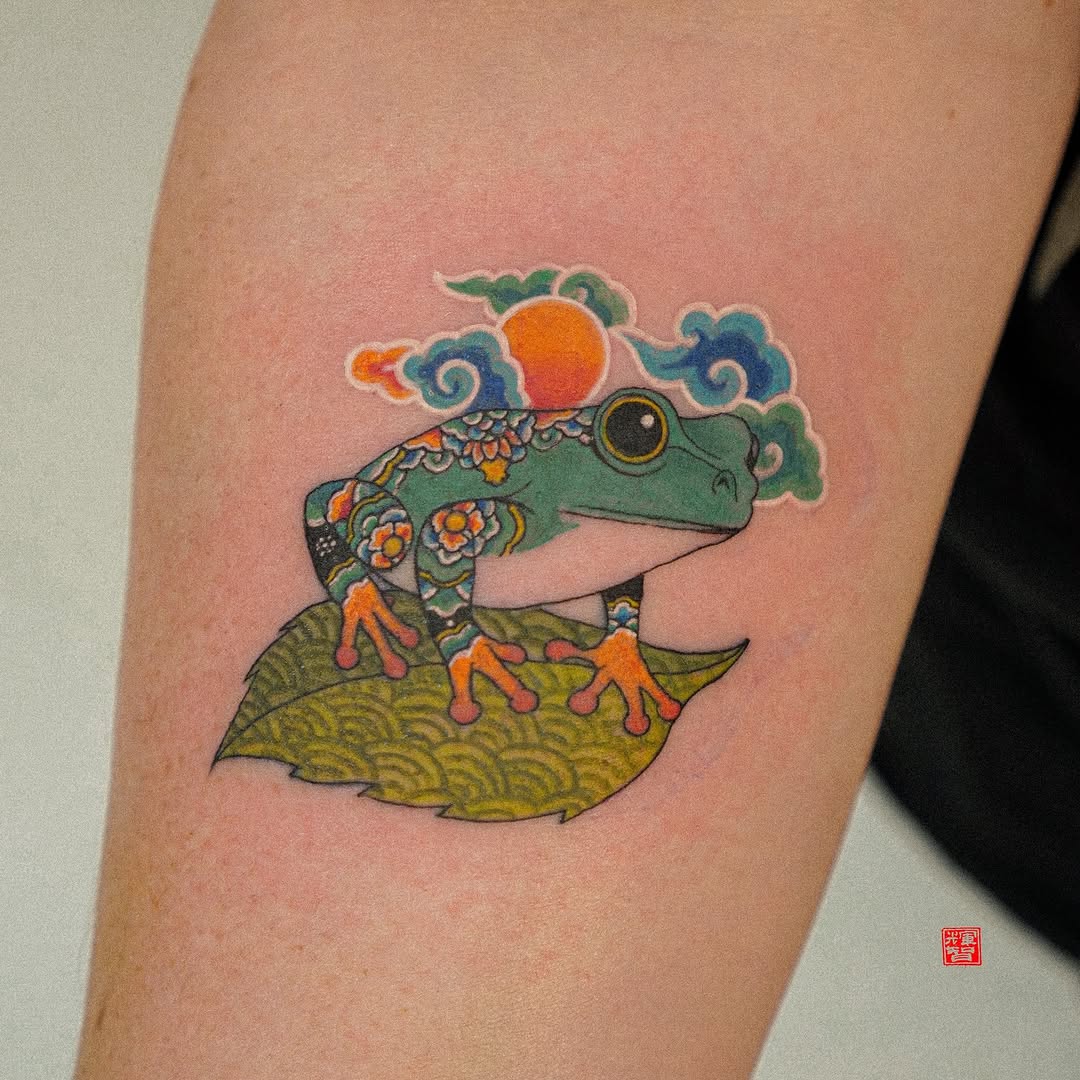Vibrant Frog Tattoo with Floral Elements