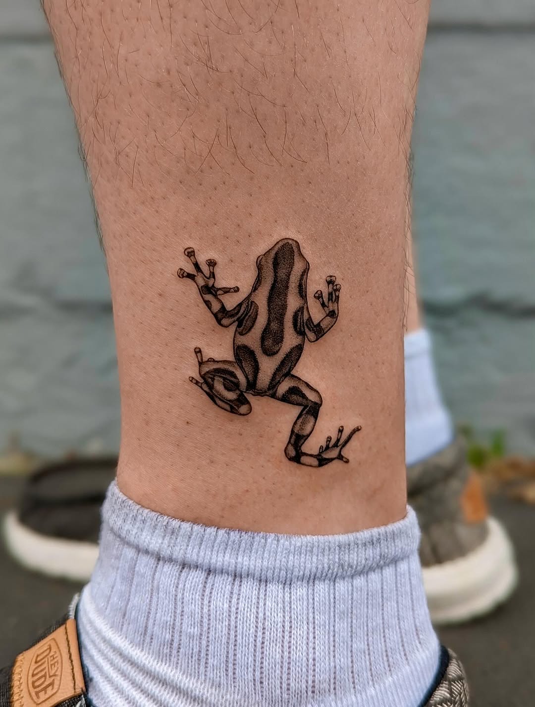 Elegant frog tattoo showcasing nature's artistry