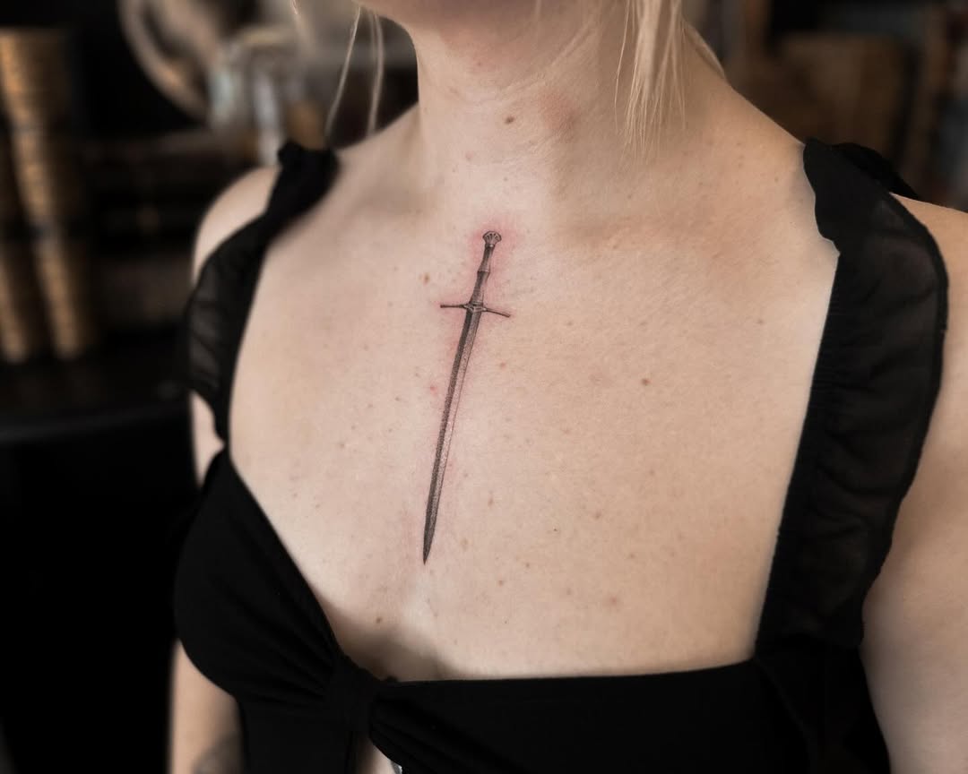 Stunning sword tattoo on the chest