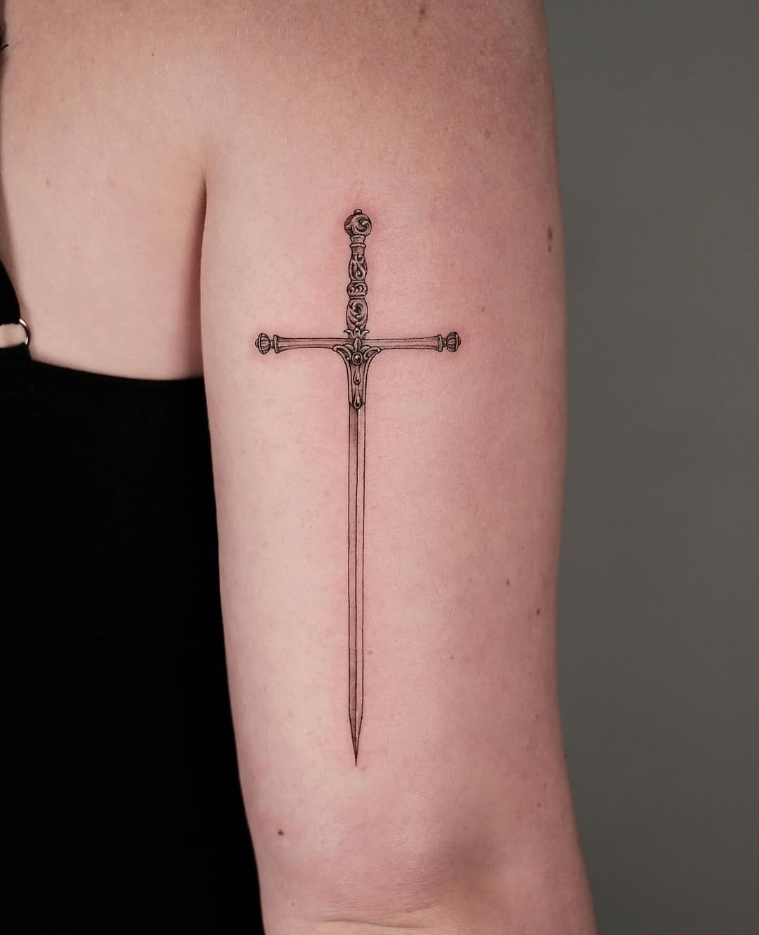 Stunning Fine Line Sword Tattoo on Arm