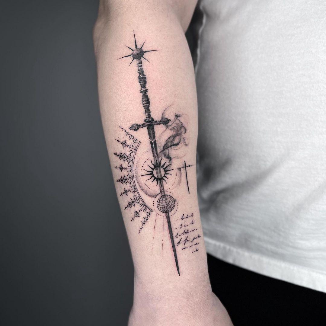 A striking sword tattoo with celestial elements