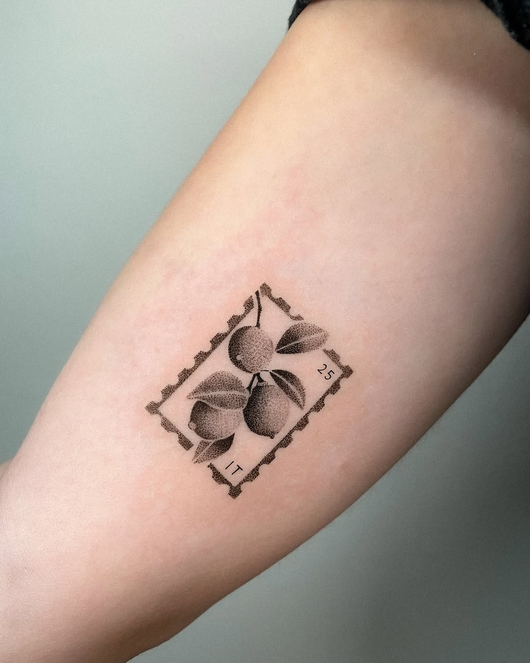 Lemon-themed stamp tattoo for a unique vibe